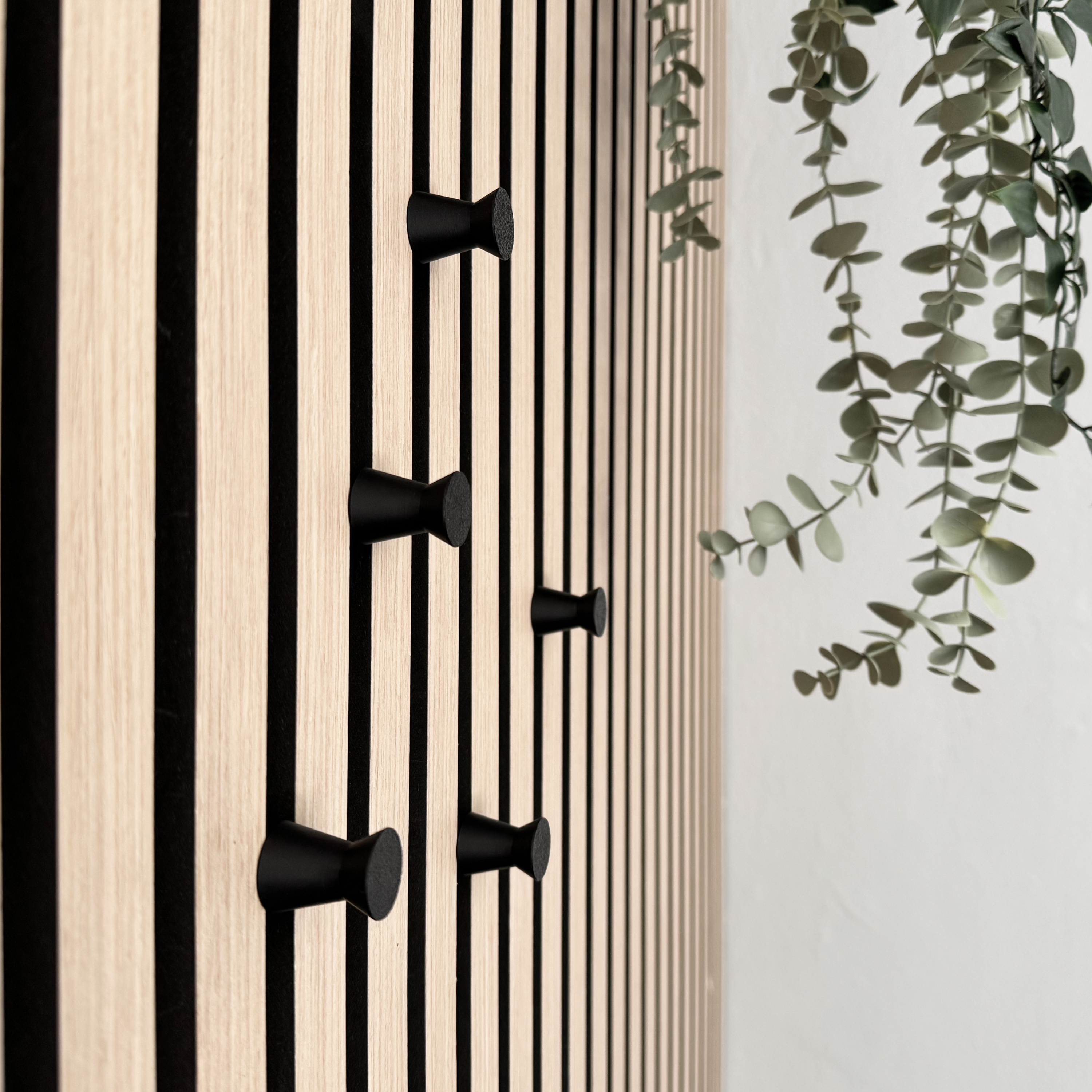 Round coat hooks for acoustic panels in various designs