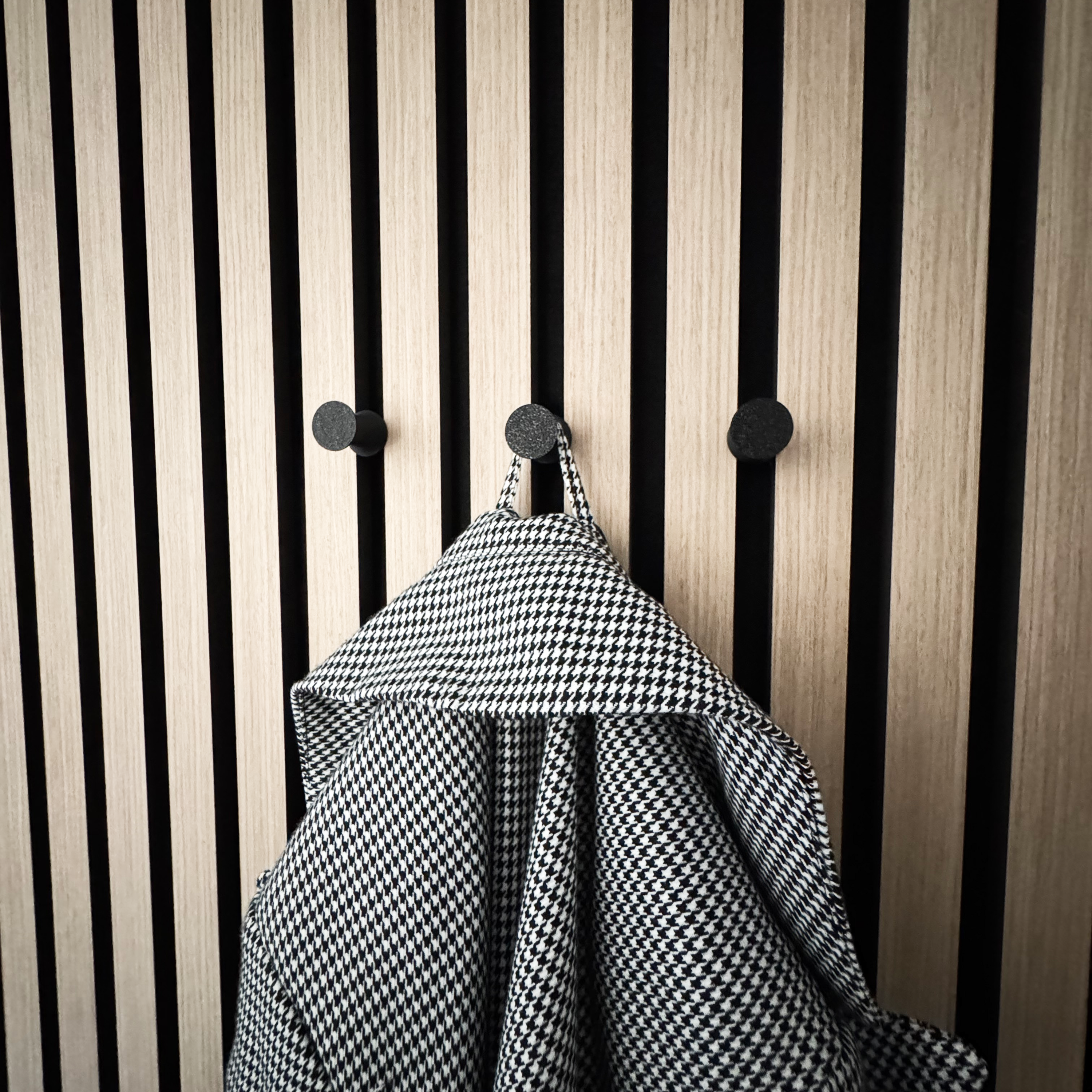 Round coat hooks for acoustic panels in various designs